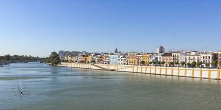 Panoramic view of Triana quarter waterfront on the left bank of the Guadalquivir river, Seville, Spain.の写真素材