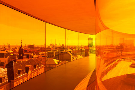 Aarhus, Denmark - May 2, 2017: View through orange tinted glass over Aarhus from inside Olafur EliassonÃ ¢ â,¬â "¢ s installation on top of Aarhus art museumのeditorial素材