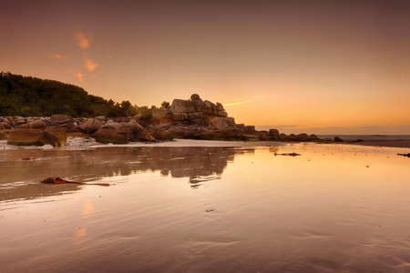 Sunset behind ancient customs house in the rocks above the beach of Kerfissien, Finistere, Franceの写真素材