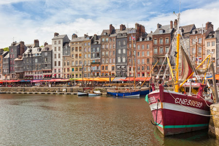 Harbor of historic city Honfleur at Normandy with boats and picturesque housesのeditorial素材