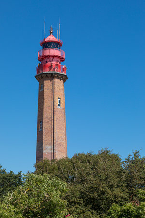 Fehmarn, Germany - July 23, 2019: Visitors on the platform of Fliegerge lighthouse on the western coast of the islandのeditorial素材