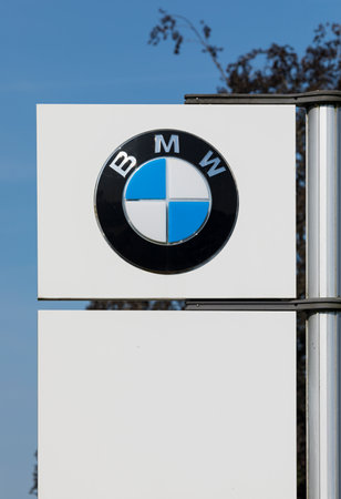 Stade, Germany - August 22, 2019: Logo on pole identifying a BMW dealership.のeditorial素材