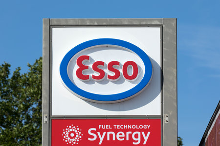 Stade, Germany - August 22, 2019: Esso logo  on pole at gas station. Esso is a brand of ExxonMobil headquartered in Irving, Texas, USA.のeditorial素材