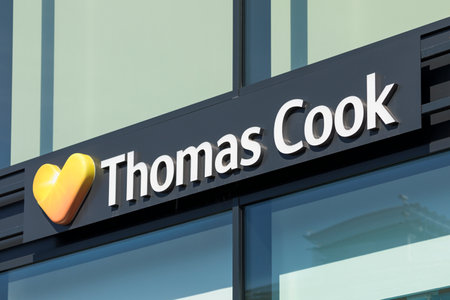 Stade, Germany - August 22, 2019: Signage identifying a Thomas Cook travel agencies branchのeditorial素材