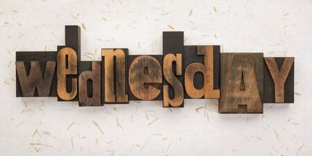 Wednesday, word written with vintage letterpress printing blocks on textured background . Banner format.の写真素材
