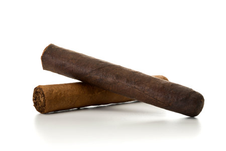 Two handmade cigars isolated on white background