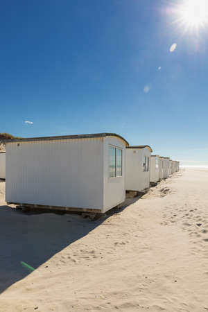 Rows of beach huts at LÃ¸kken on the North Sea coast of Denmarkの写真素材