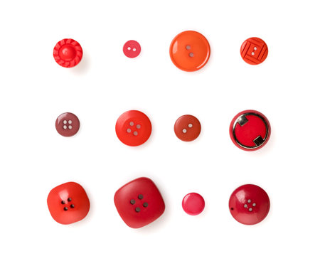 Collection of 12 red buttons isolated on white background