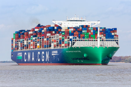 Stade, Germany - May 8, 2021: CMA CGM Montmartre, one of the largest container vessels powered by Liquid Natural Gas, on Elbe river heading to Hamburg,のeditorial素材