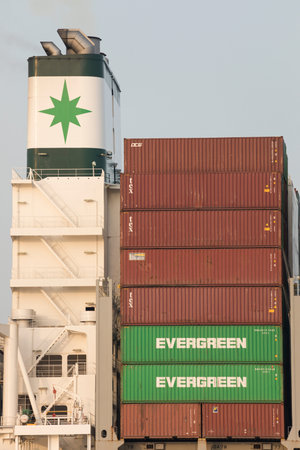 Stade, Germany - March 31, 2021: Chimney and stacked containers, detail of Container ship EVER...