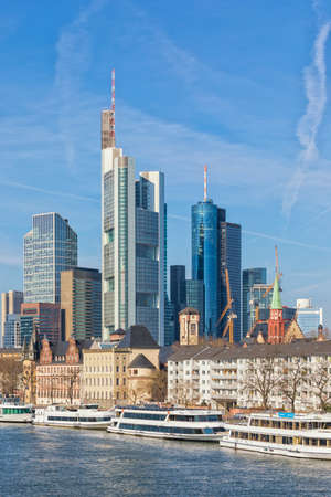 Financial district of Frankfurt with skyscrapers and Main river waterfront, verticalの写真素材