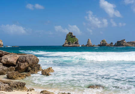 Anse de Chateaux, bay at east tip of Guadeloupe with Pointes des Colibris rocksの写真素材