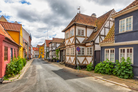 Street with half-timbered houses at the historic old town of Svendborg, Funen, Denmarkの写真素材