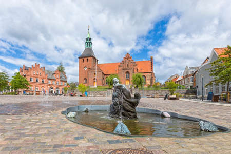 Torvet, the town square at Svendborg, Denmark, with Church Of Our Lady and Mermaid Fountainの写真素材