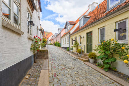 Idyllic cobblestone alley at the old town of Odenseの写真素材