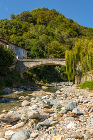 Ancient roma bridge crossing Livo river at Domaso, Lombardy, Italyの写真素材