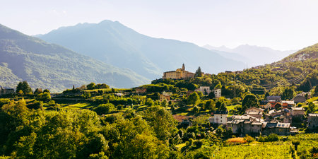 Panoramic rural landscape with Convento di San Lorenzo , village of Sant'Anna outside Sondrio, Valtellina, Italyの写真素材