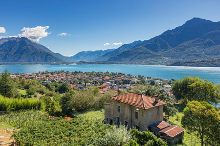 View from Pozzolo over the town of Domaso and the north of Lake Como to Valtellina valley and river Addaの写真素材