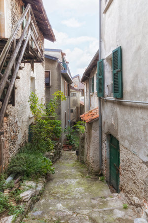 Very narrow alley at the old town of Domaso, Lombardy, Italyの写真素材