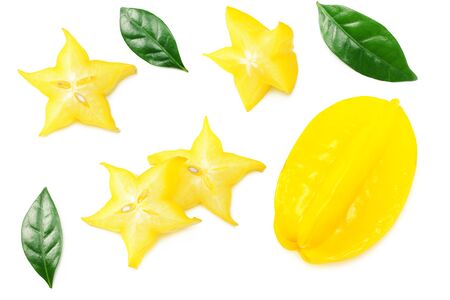Yellow Carambola with green leaves and slices isolated on white background. top viewの写真素材