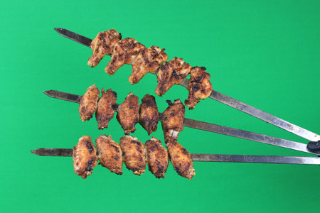 Skewered Grilled Chicken Kababs Isolated on Green Screen Chroma Key Stock Photosの写真素材