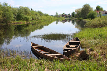 old wooden boats at the riverの写真素材