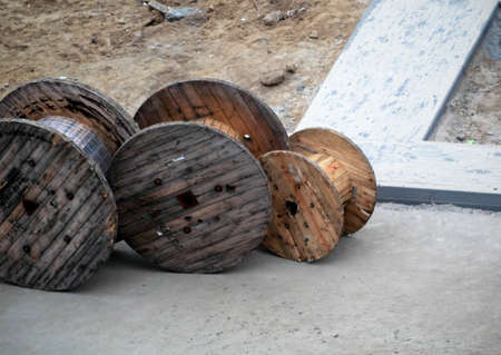 wooden coils for cable in the construction yardの写真素材