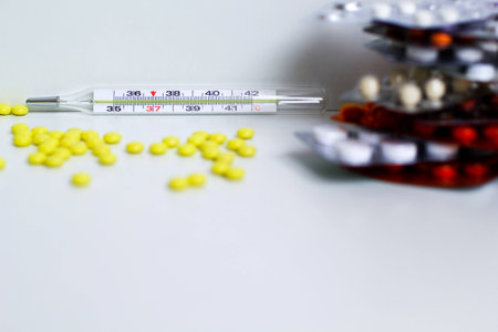 medical thermometer and pillsの写真素材
