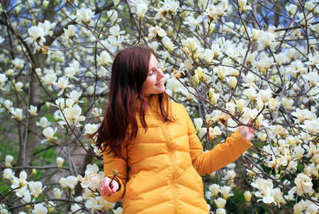 woman and white magnoliasの写真素材