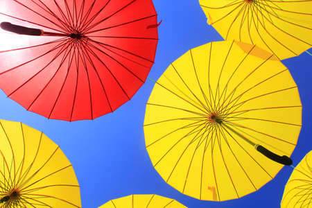 colorful umbrellas in the skyの写真素材