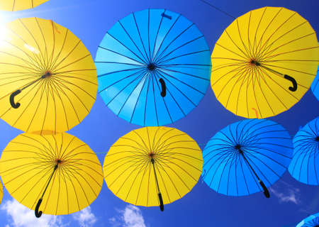colorful umbrellas in the skyの写真素材