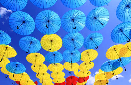 colorful umbrellas in the skyの写真素材