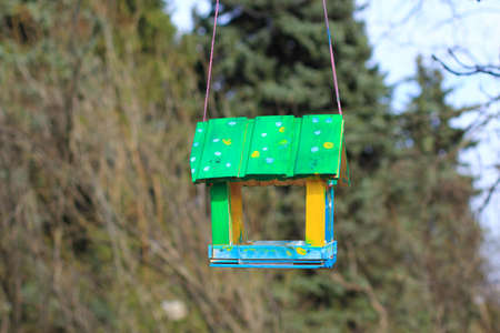 wooden house bird feederの写真素材