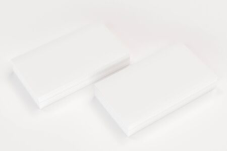 White blank business cards mock-up on white background. Corporate stationery template. 3D rendering illustrationの写真素材