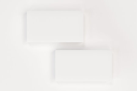 White blank business cards mock-up on white background. Corporate stationery template. 3D rendering illustrationの写真素材