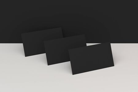 Black blank business cards mock-up on black and white background. Corporate stationery template. 3D rendering illustrationの写真素材