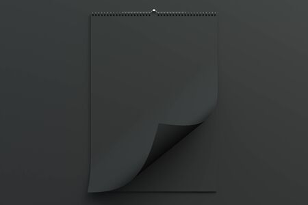 Black wall calendar mock-up on black background. Blank spiral calendar template. 3D rendering illustrationの写真素材