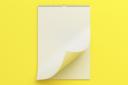 White wall calendar mock-up on yellow background. Blank spiral calendar template. 3D rendering illustrationの写真素材