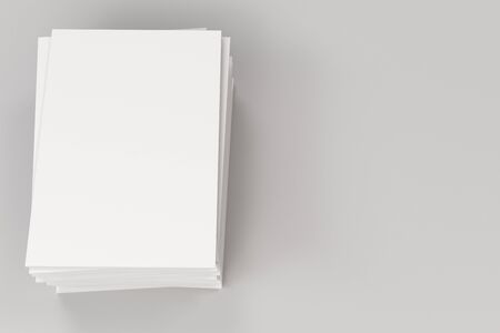 Stack of blank white closed brochure mock-up on white background. Magazine cover template. 3D rendering illustrationの写真素材