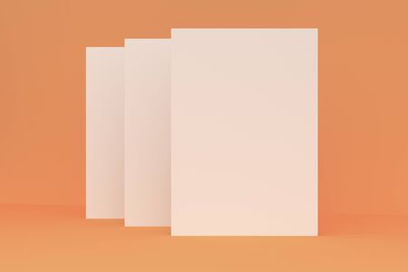Three blank white closed brochure mock-up on orange background. Magazine cover template. 3D rendering illustrationの写真素材