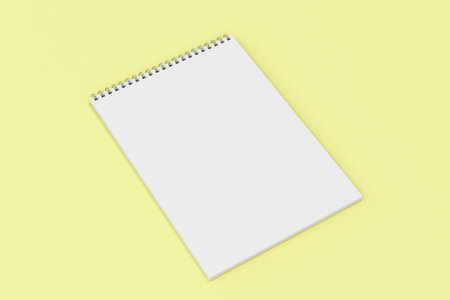 Blank white notebook with metal spiral bound on yellow background. Business or education mockup. 3D...