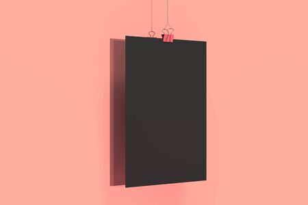 Blank black poster with binder clip mockup on red background. Poster or paper sheet template. 3D rendering illustrationの写真素材