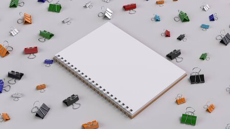 Blank spiral notebook with colorful binder clips on white table. Business, education or office mockup. 3D rendering illustration.の写真素材