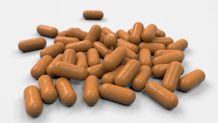 Pile of orange medicine capsules on white background. Medical, healthcare or pharmacy concept. 3D rendering illustrationの写真素材