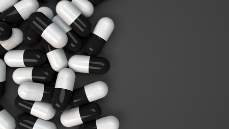 Pile of black and white medicine capsules on black background. Medical, healthcare or pharmacy concept. 3D rendering illustrationの写真素材