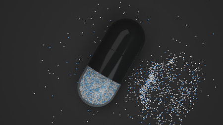 Capsule of colorful medicine on black background. Medical or pharmacy concept. 3D rendering illustrationの写真素材