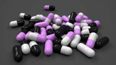 Pile of black, white and purple medicine capsules on black background. Medical, healthcare or...