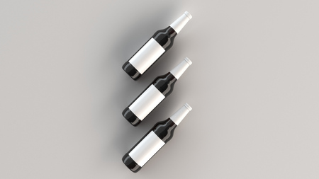 Mock up of three tall brown beer bottles 0.5l with blank white labels on white background. Design or branding template. 3D rendering illustrationの写真素材