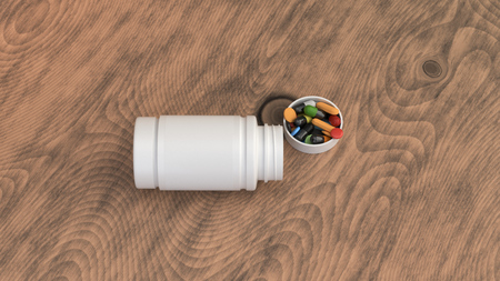 Realistic blank white open plastic bottle with pills lying on the wooden surface. Medical container. Drug bottle mockup. 3D render illustrationの写真素材