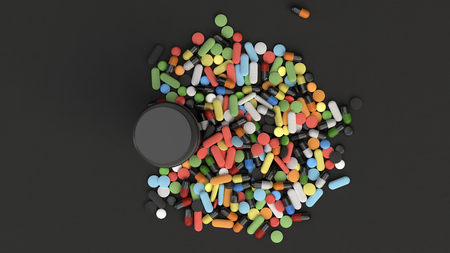 Realistic blank black plastic bottle and pile of pills on black background. Medical container. Drug bottle mockup. 3D render illustrationの写真素材